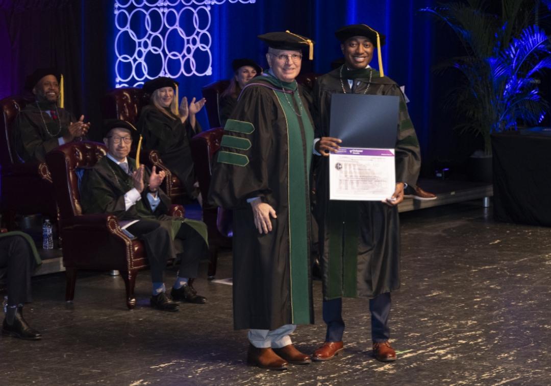 Dr Joseph being presented with his award at the Culmination ceremony