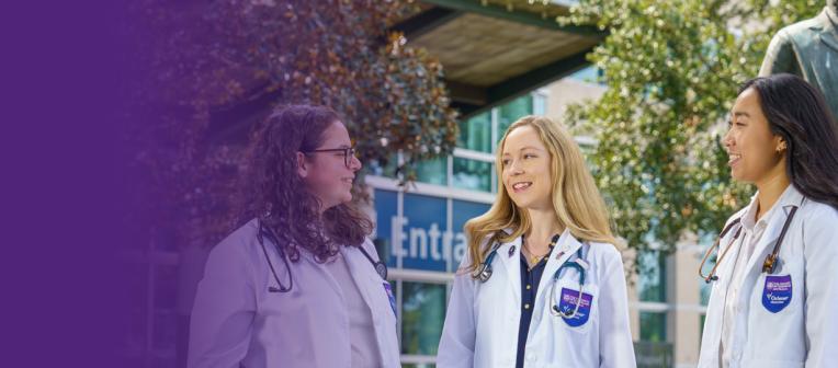 Three students in white coats