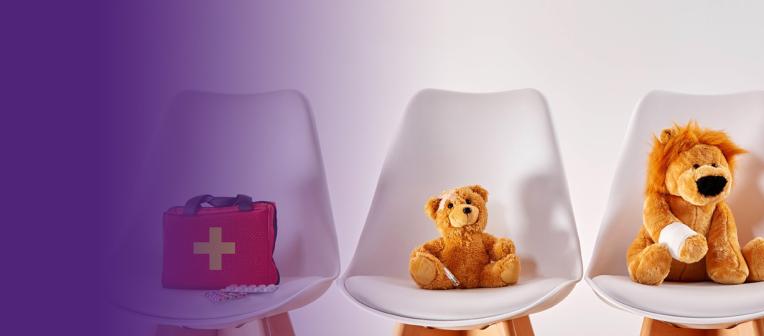 Injured stuffed toys on white chairs