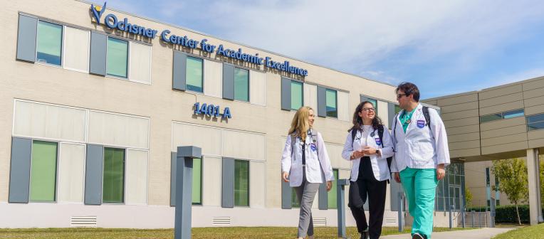 Medical Students walking past the Ochsner Clinical School