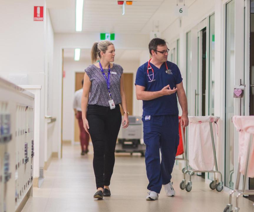 Doctors walking down hall